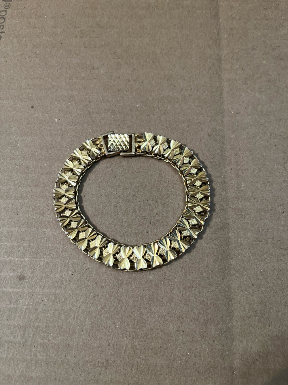 Gold Tone Bracelet With Bow Design And Clasp Closure 8”